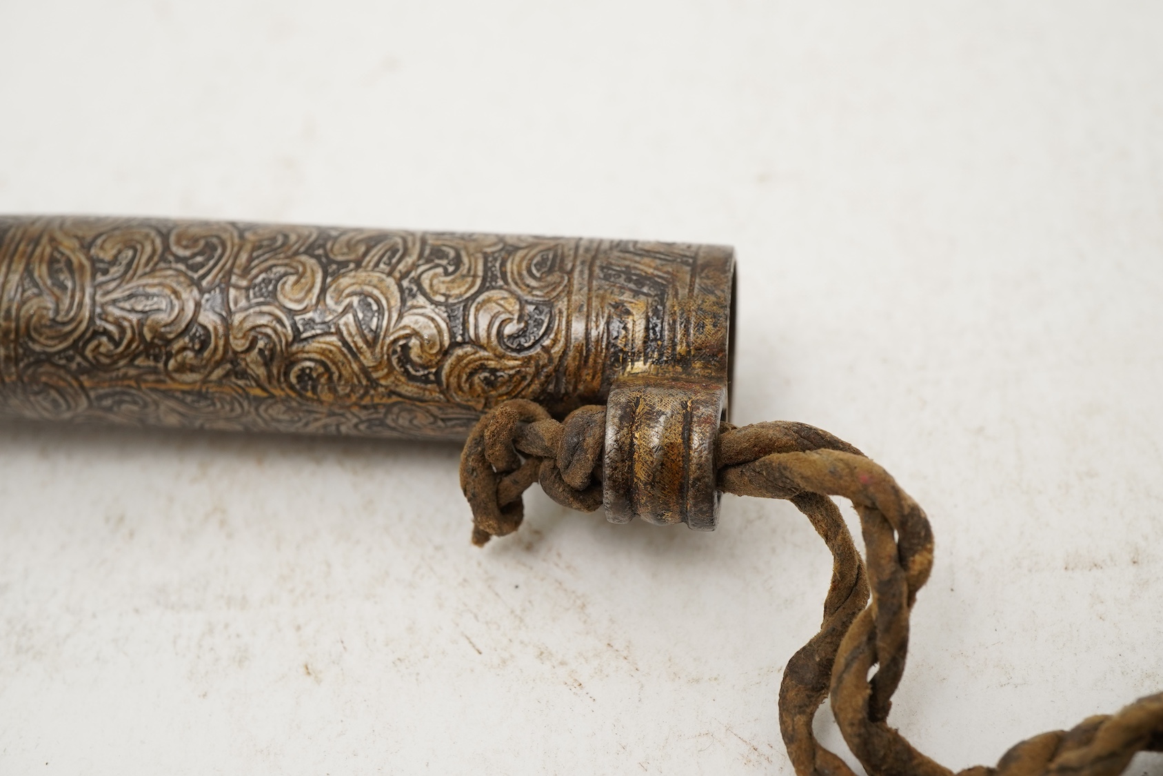 A Tibetan damascened iron scroll holder, 17th century